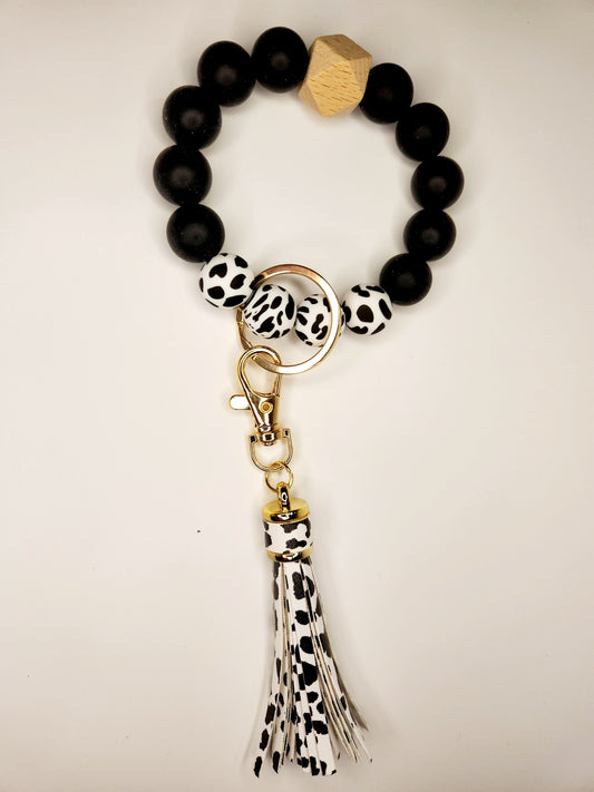 Silicone beaded tassel keychain (black and cow print)